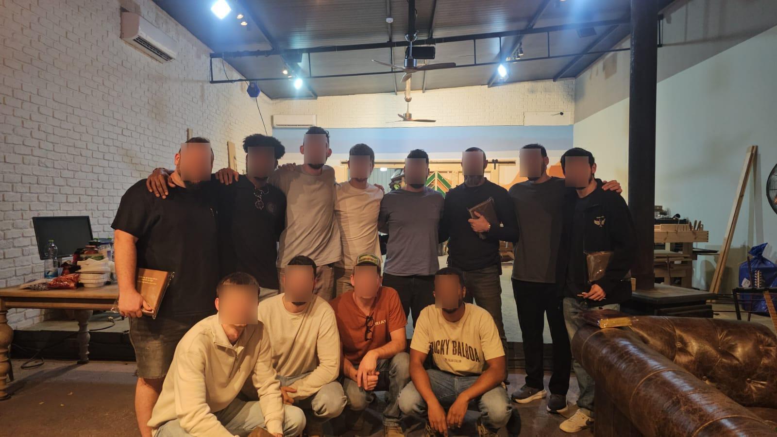 Workshop participants posing indoors